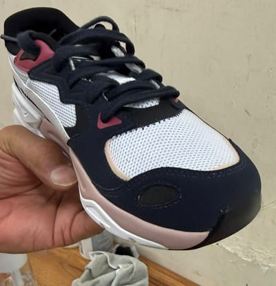 After: the same trainer with the mould removed from the toe and seams